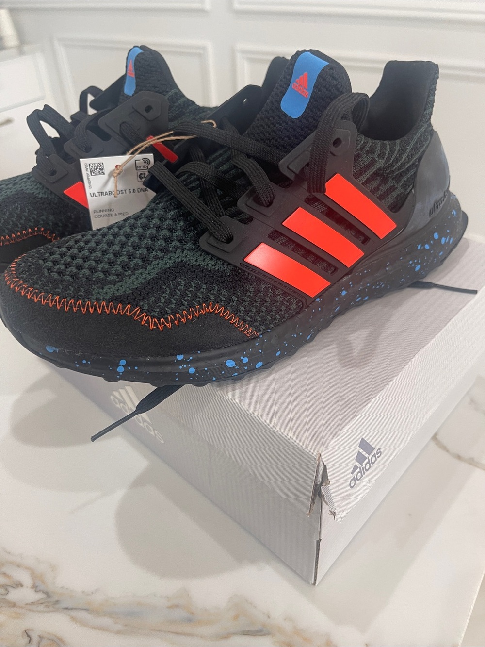 adidas Kids Black Sneakers with Bright Red Stripes and Blue Speckle